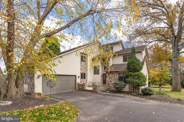 a view of a house with a snow in the yard