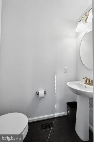 a bathroom with a sink toilet and vanity