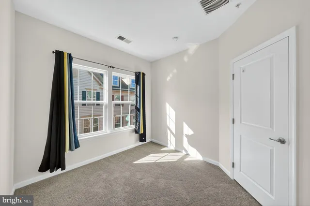 a view of empty room with a window