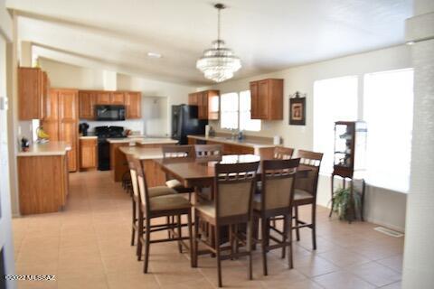 13643 East Bright Sky Loop Vail, AZ 85641 - Photo 3 of 22 a view of a dining room with furniture