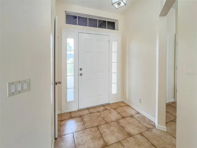 a view of a hallway to rooms