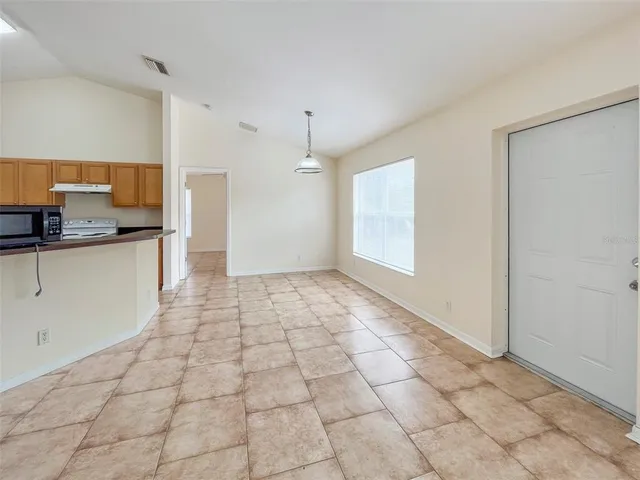 a view of a kitchen with a sink and a window