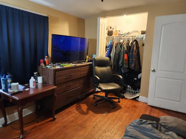 a room with furniture and wooden floor