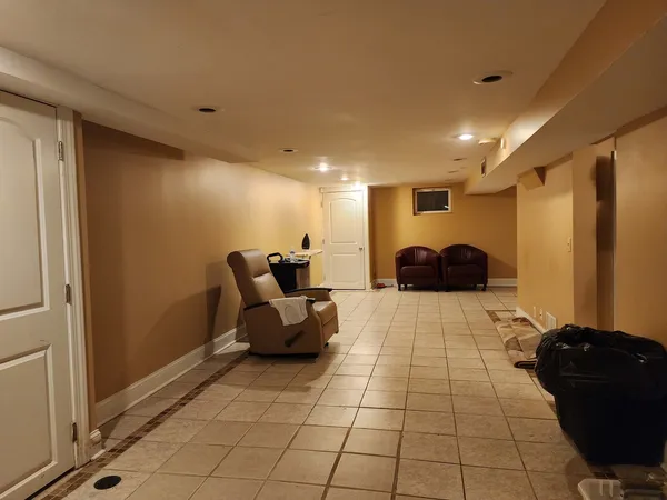 a lobby with a couch and a rug
