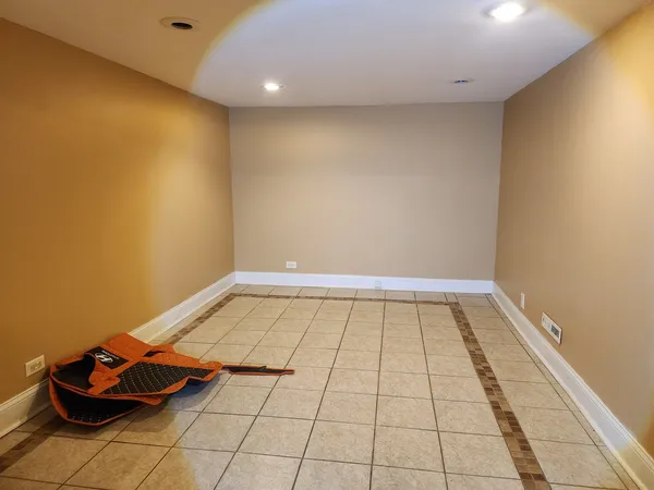 a view of a room with wooden floor and shoes