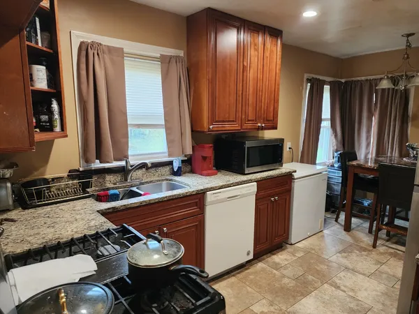 a kitchen with a stove and a sink
