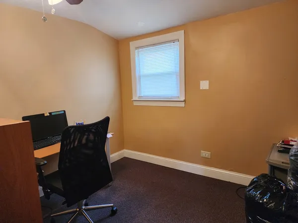 a bedroom with a bed and cabinets