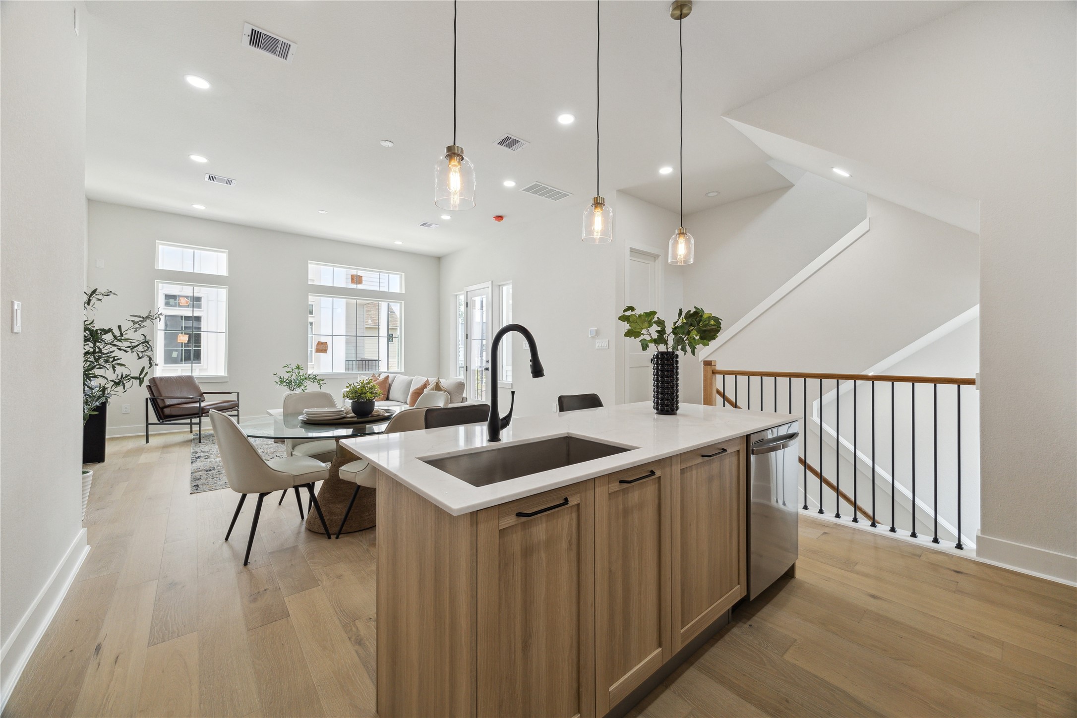 3911 Tulane Street, Unit C Houston, TX 77018 - Photo 6 of 38 Modern open-concept kitchen, dining, and living area with sleek finishes and abundant natural light.
