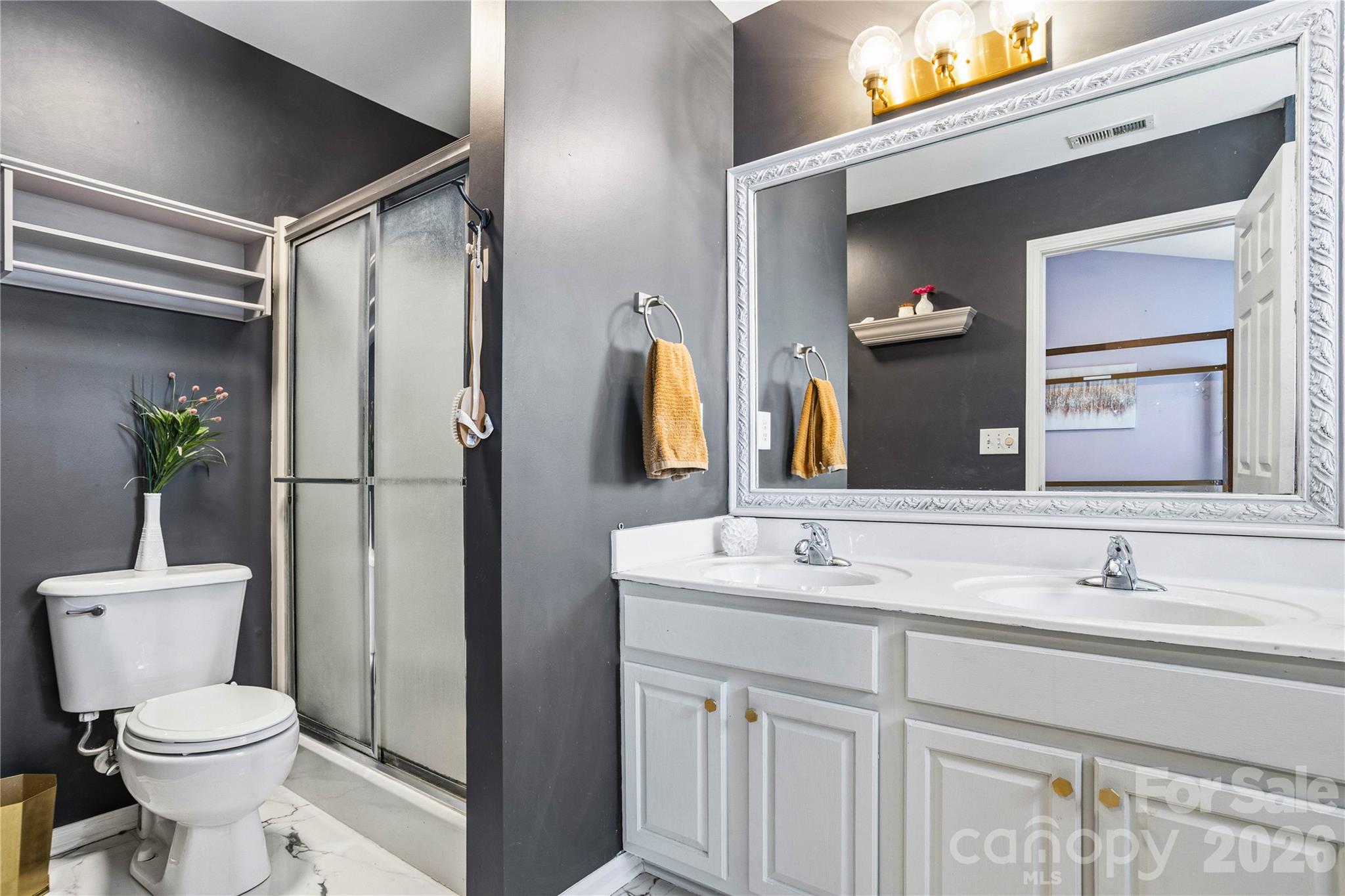 101 Rock Ridge Lane Mount Holly, NC 28120 - Photo 19 of 35 a bathroom with a sink toilet and shower
