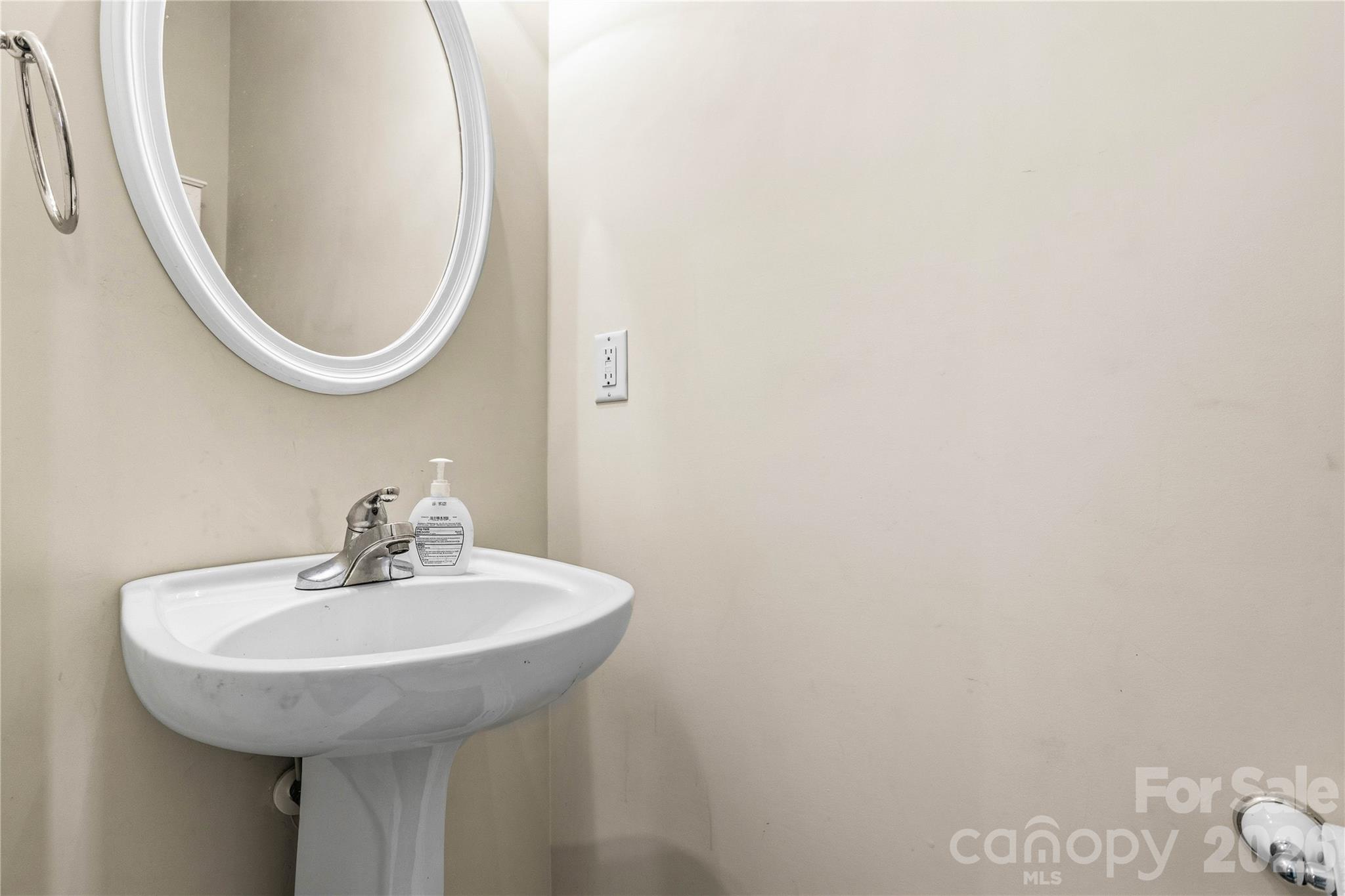 101 Rock Ridge Lane Mount Holly, NC 28120 - Photo 21 of 35 a bathroom with a sink and a mirror