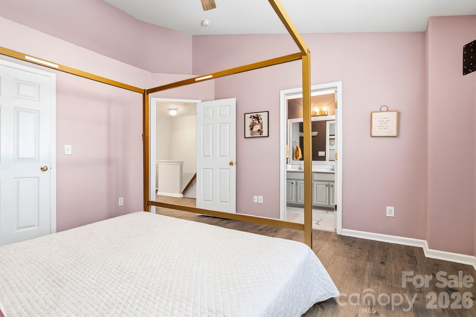 101 Rock Ridge Lane Mount Holly, NC 28120 - Photo 23 of 35 a bedroom with a large bed and a closet