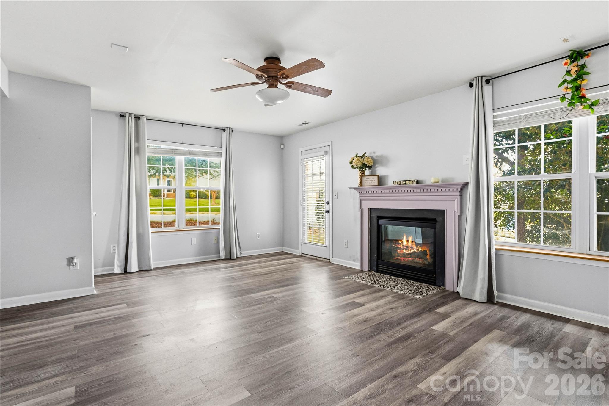 101 Rock Ridge Lane Mount Holly, NC 28120 - Photo 7 of 35 a view of an empty room with a fireplace and a window
