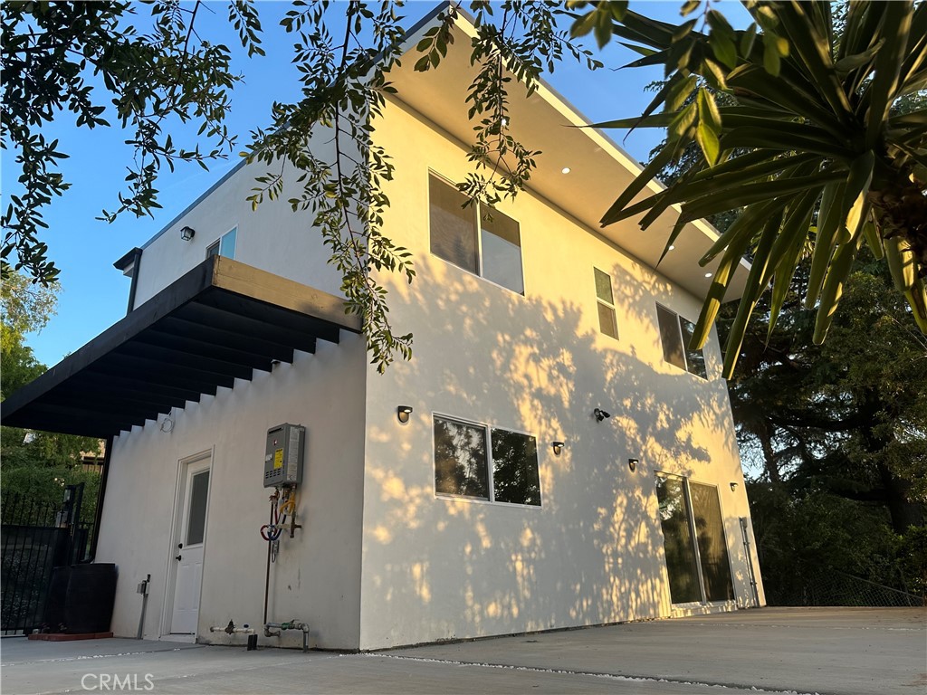 22823 Crespi Street Woodland Hills, CA 91364 - Photo 1 of 1 a view of a building with a tree
