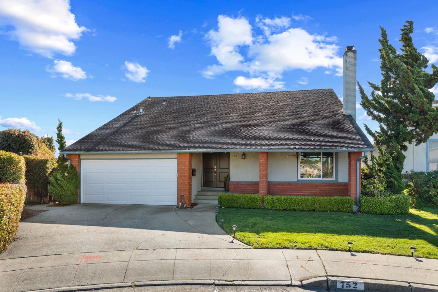 752 Ranger Circle Foster City, CA 94404 - Photo 1 of 1 a front view of a house with garage and garden