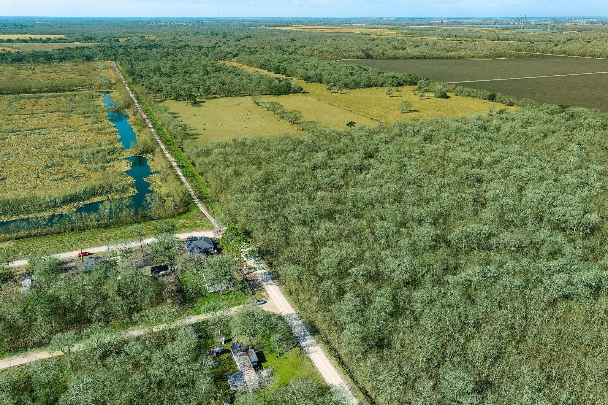 Tbd Tbd Tr Guy, TX 77444 - Photo 7 of 21 a view of a yard with a lake