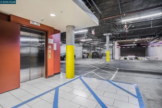 a view of parking garage with a glass door