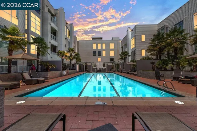 a view of a patio with table and chairs and potted plants