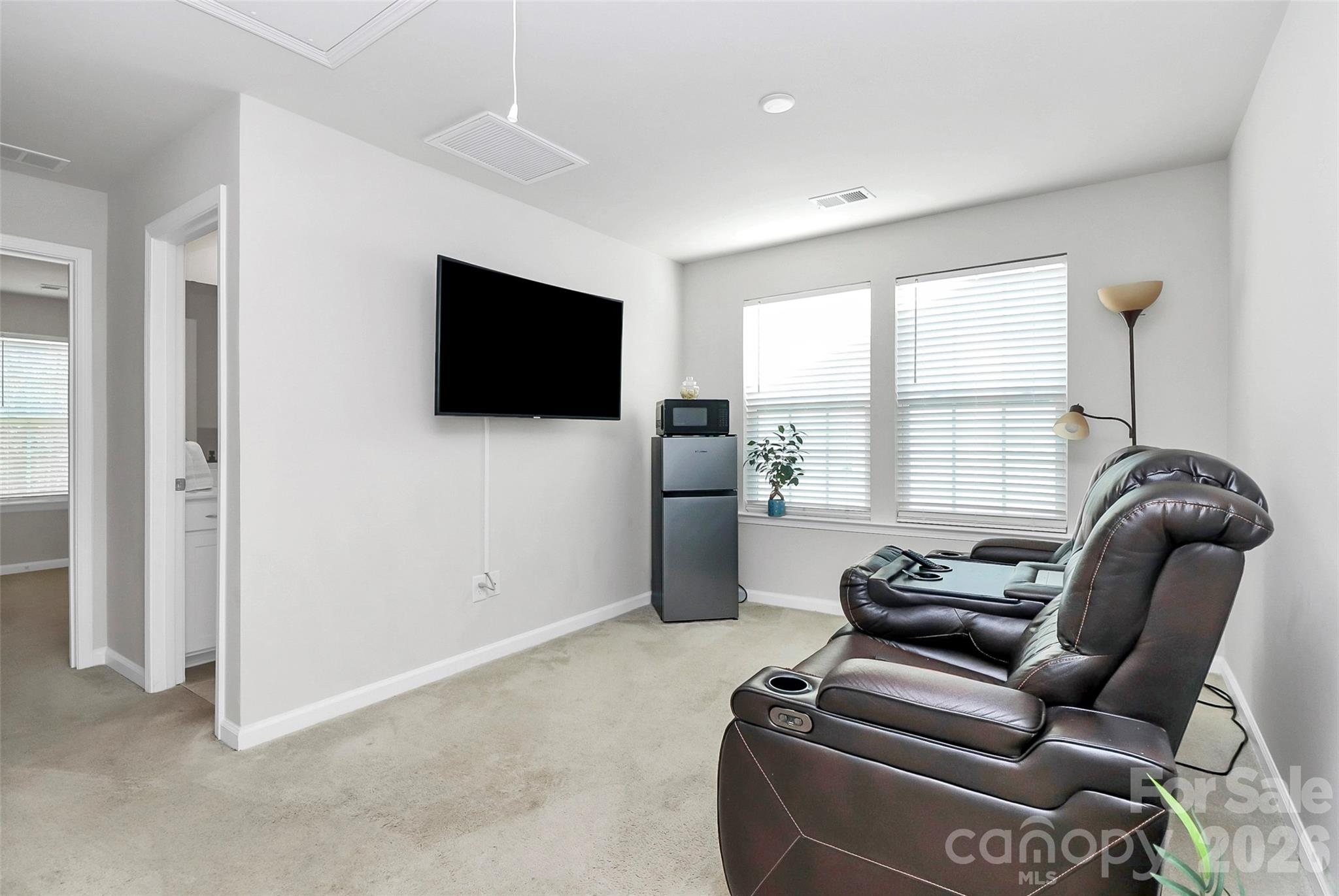 5766 Soft Shell Drive Lancaster, SC 29720 - Photo 19 of 33 a living room with furniture and a flat screen tv