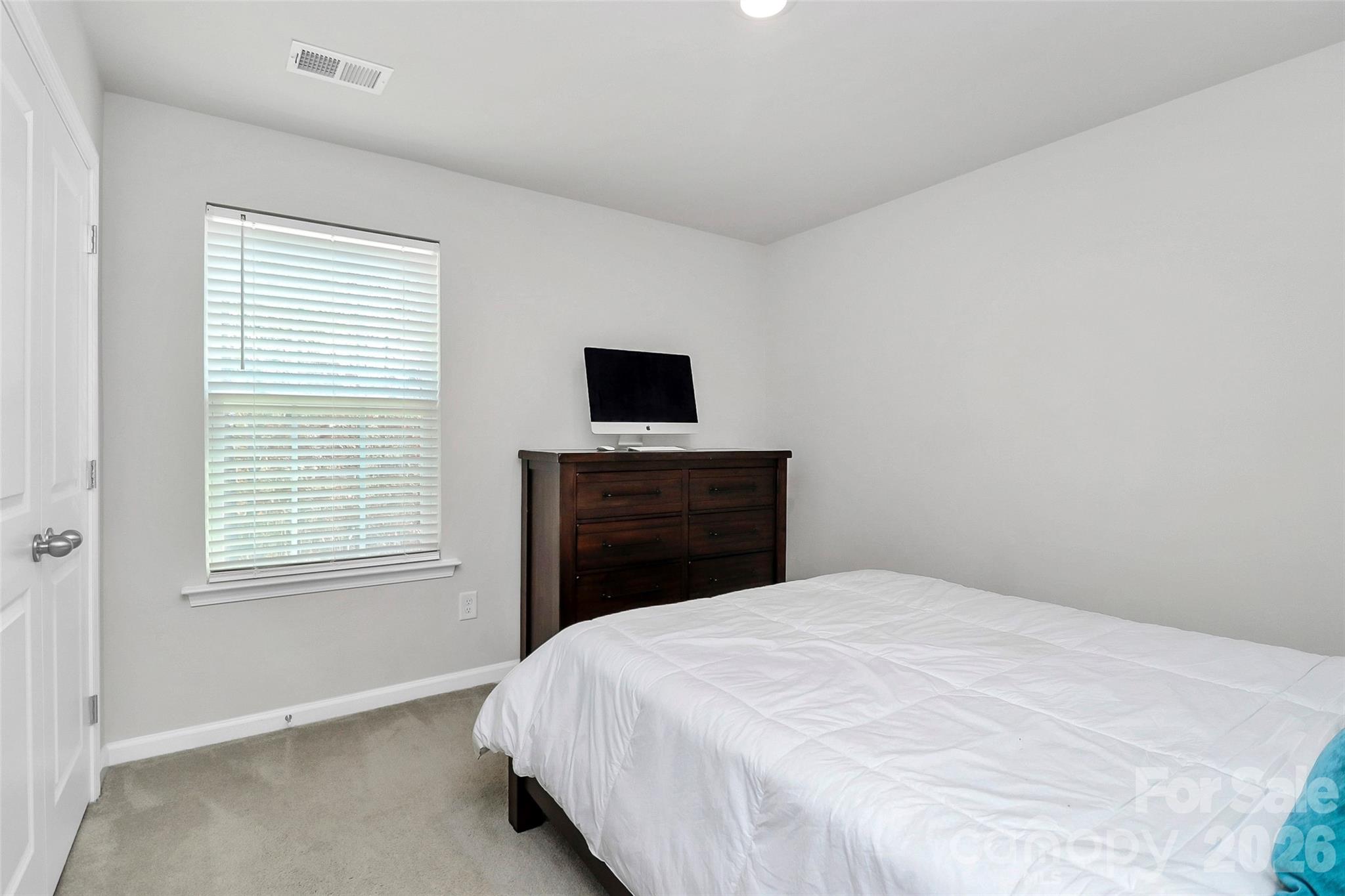 5766 Soft Shell Drive Lancaster, SC 29720 - Photo 21 of 33 a bedroom with a bed and a tv
