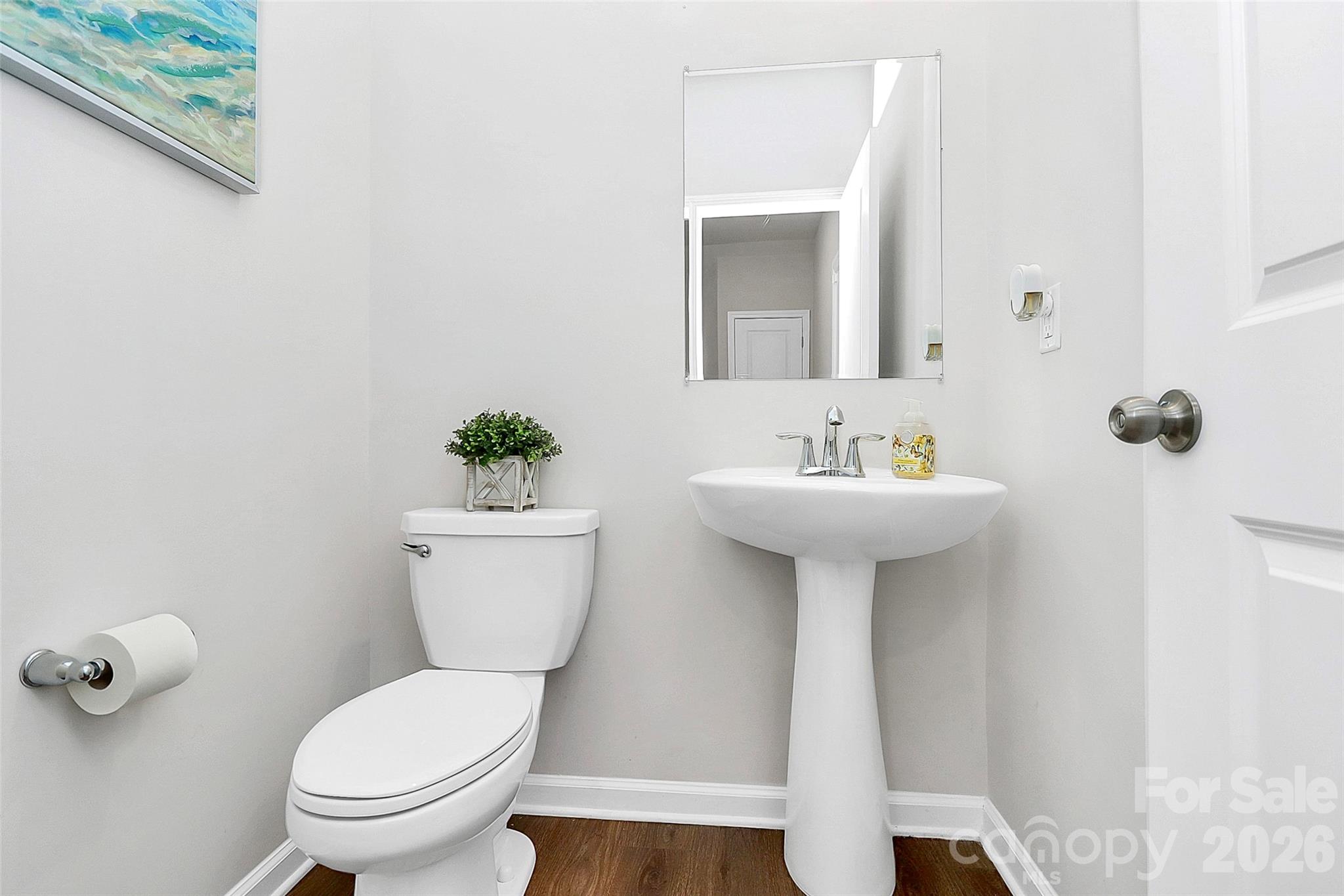 5766 Soft Shell Drive Lancaster, SC 29720 - Photo 25 of 33 a bathroom with a sink toilet and a mirror