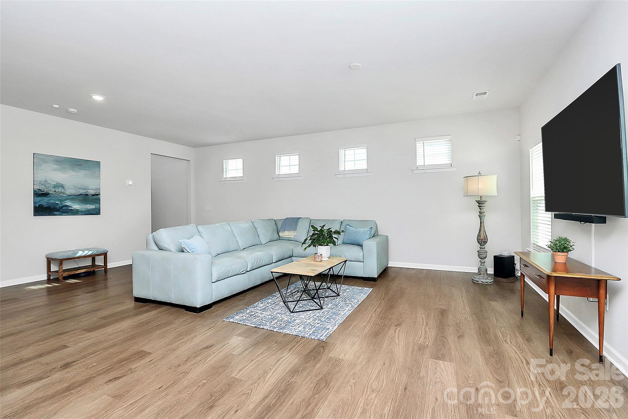 5766 Soft Shell Drive Lancaster, SC 29720 - Photo 4 of 33 a living room with furniture and a flat screen tv