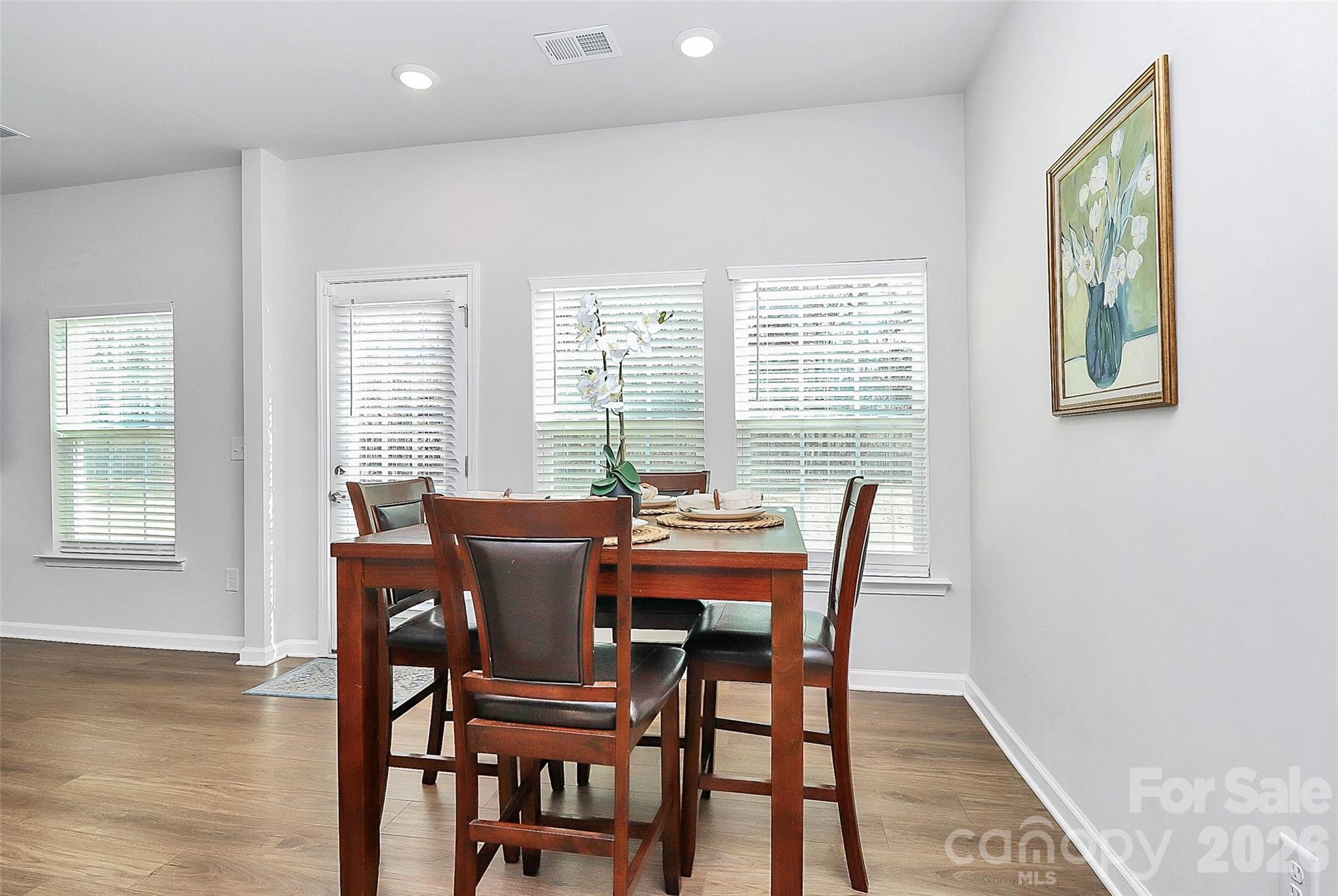 5766 Soft Shell Drive Lancaster, SC 29720 - Photo 9 of 33 a view of a dining room with furniture and wooden floor