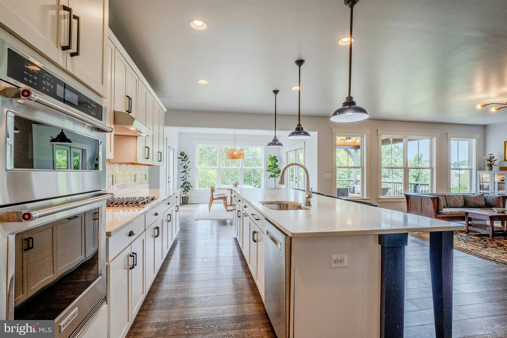 18120 Ridgewood Place Round Hill, VA 20141 - Photo 8 of 46 a large kitchen with stainless steel appliances granite countertop a lot of counter space and a wooden floor