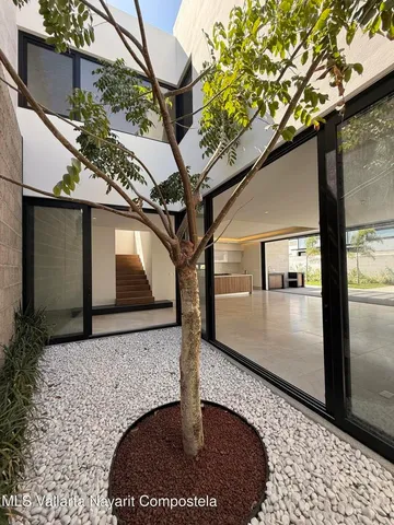 a bathroom with a double vanity sink and mirror