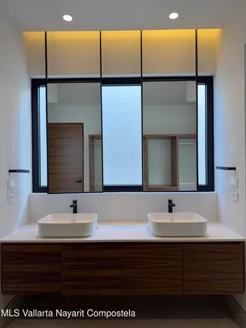 a bedroom with a bed and a walk in closet