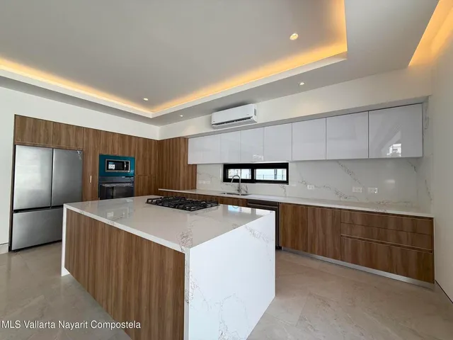 a kitchen with stainless steel appliances a sink and stove