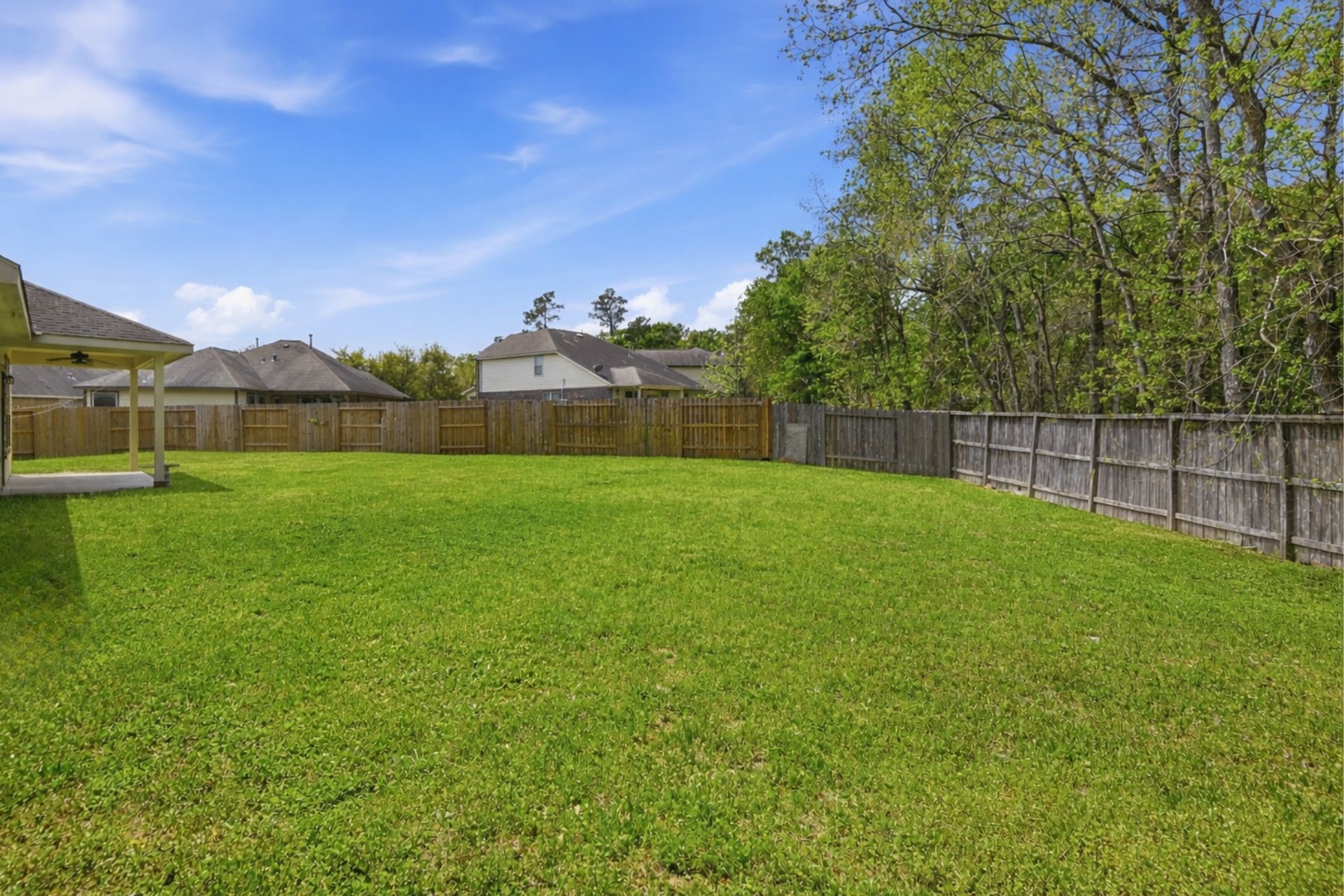 7 Maple Mill Court Conroe, TX 77301 - Photo 18 of 21 a view of a backyard
