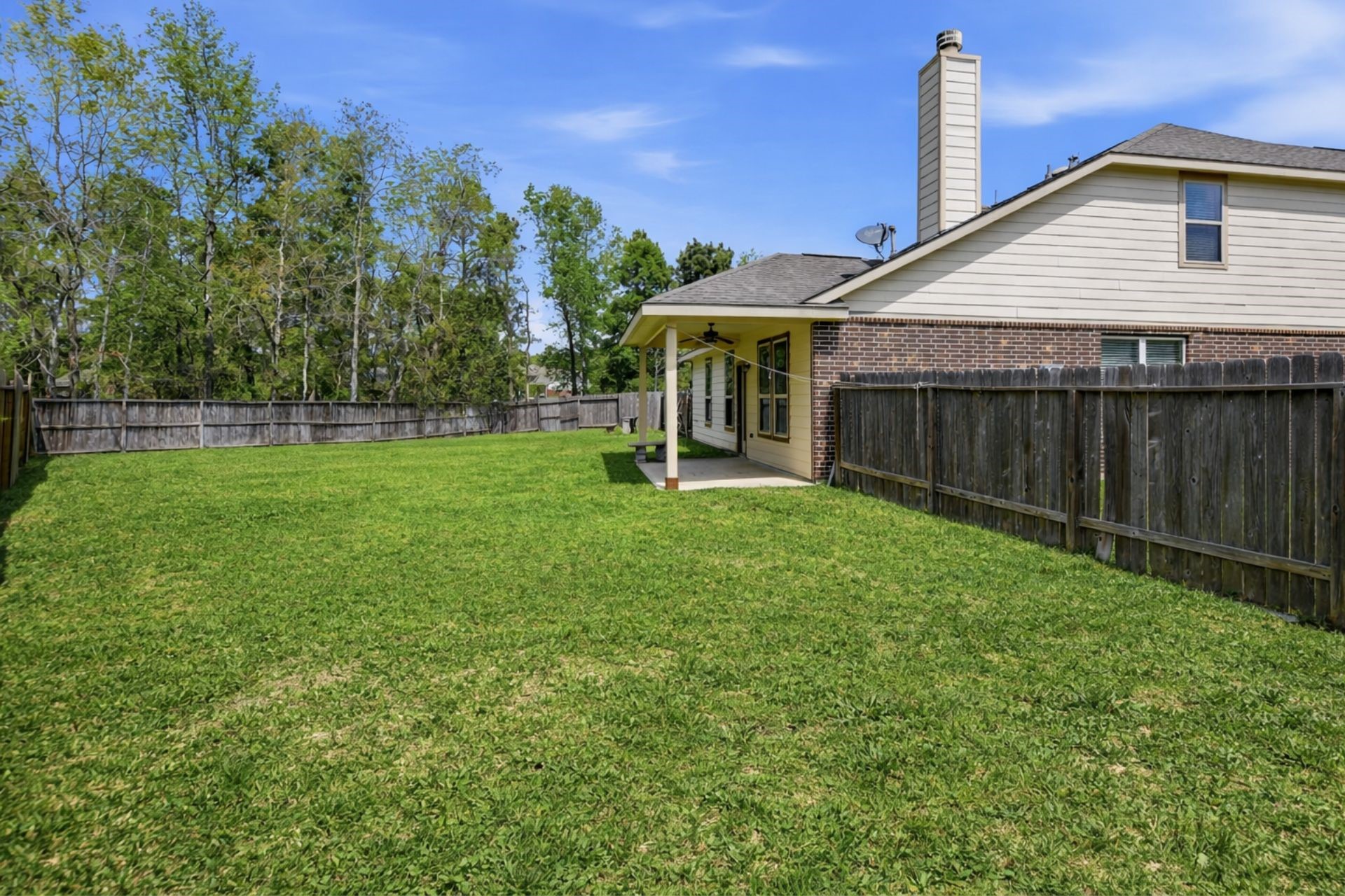 7 Maple Mill Court Conroe, TX 77301 - Photo 19 of 21 a view of a house with a yard and sitting area