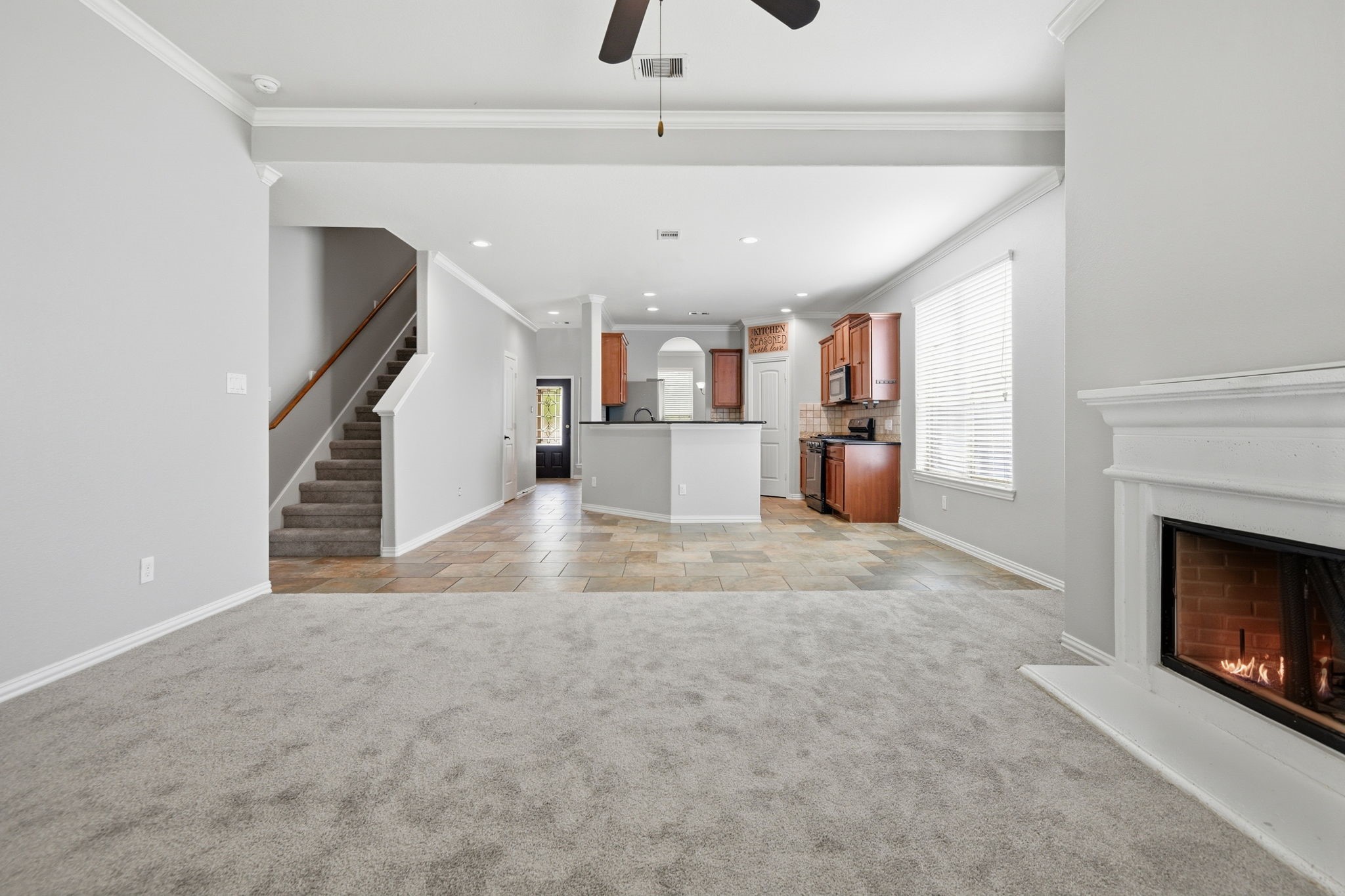 7 Maple Mill Court Conroe, TX 77301 - Photo 5 of 21 a view of a kitchen and a fireplace