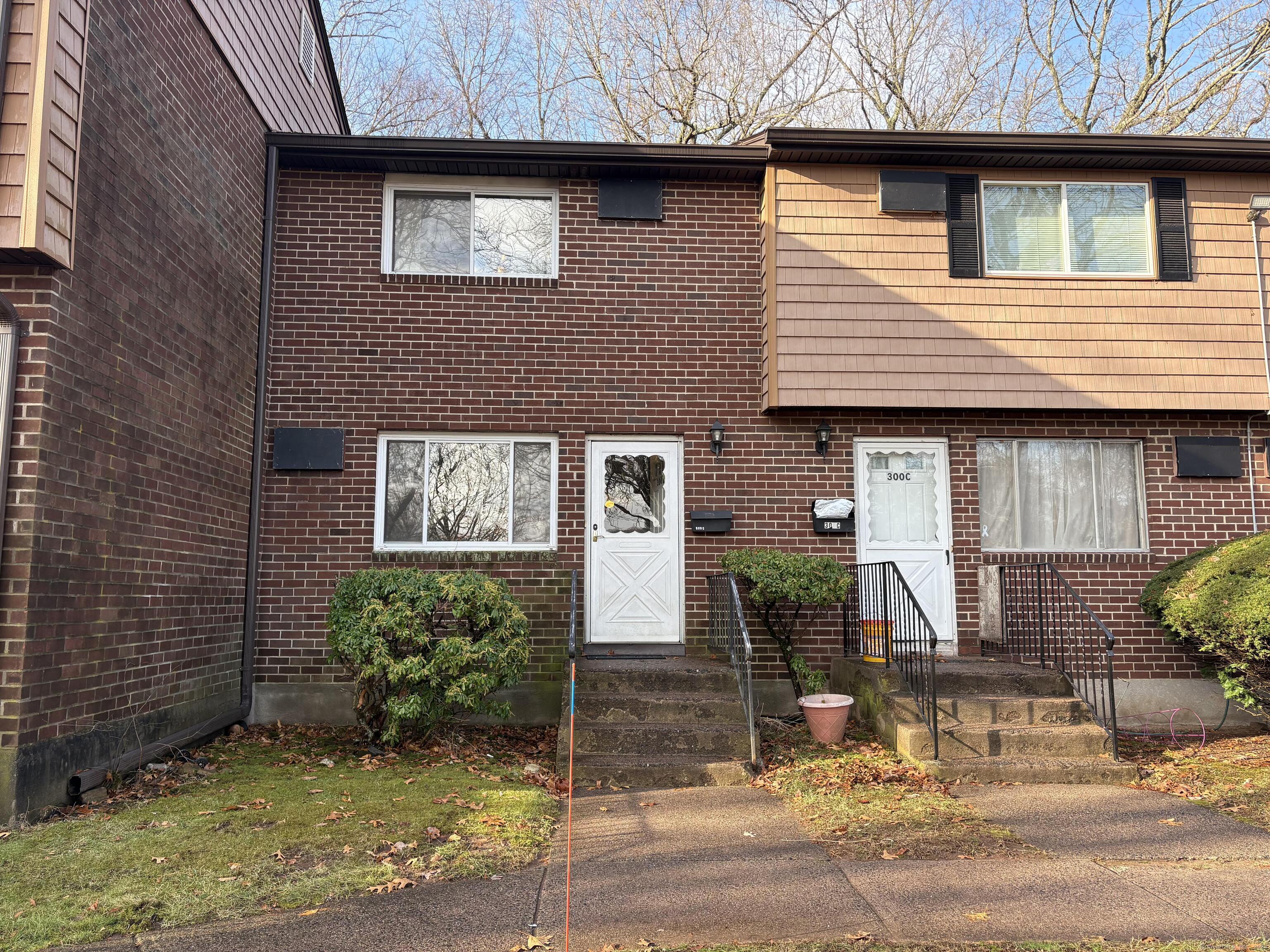 300 Green Road, Unit D Manchester, CT 06042 - Photo 1 of 1 a view of a brick house with many windows