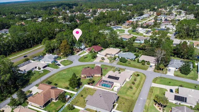 a aerial view of swimming pool patio and mountain view in back