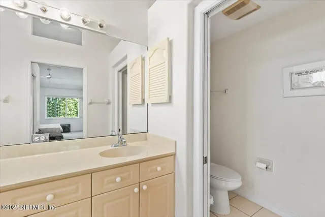 a bathroom with a sink toilet a mirror and shower