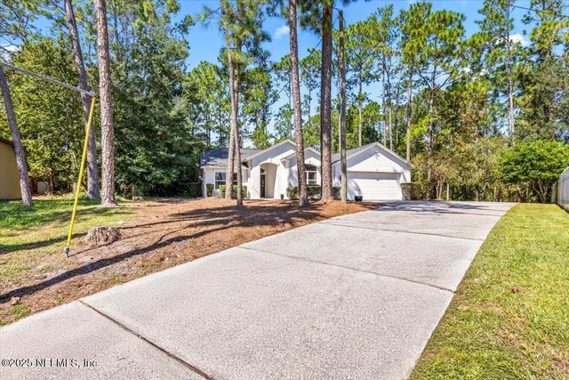 a view of a house with a street