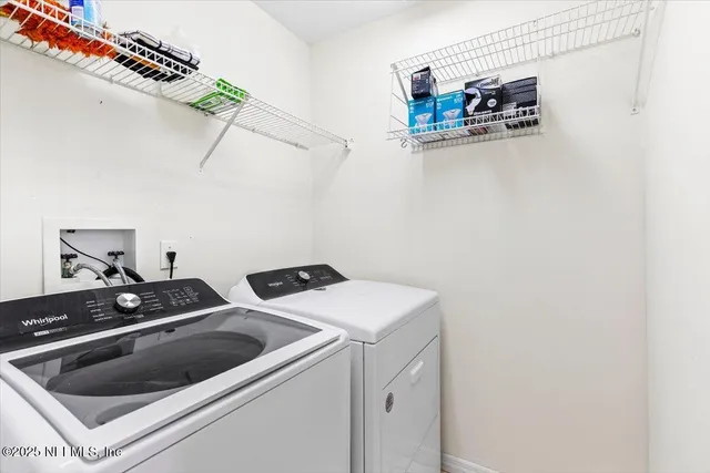 a utility room with dryer and washer