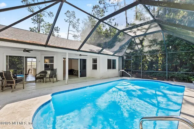 a swimming pool with outdoor seating