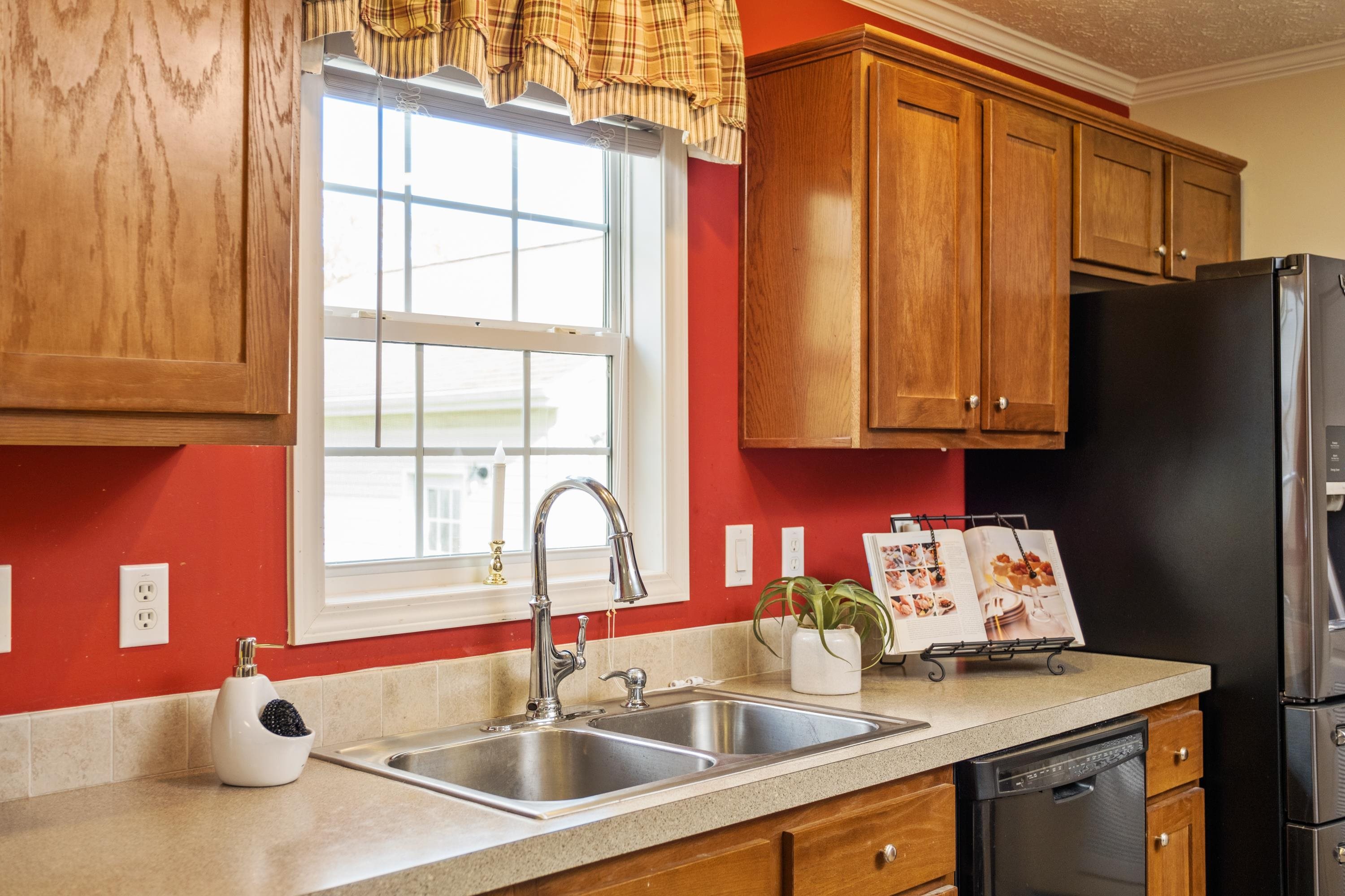 1715 3rd Street Waynesboro, VA 22980 - Photo 16 of 33 a kitchen with stainless steel appliances granite countertop a sink and a window
