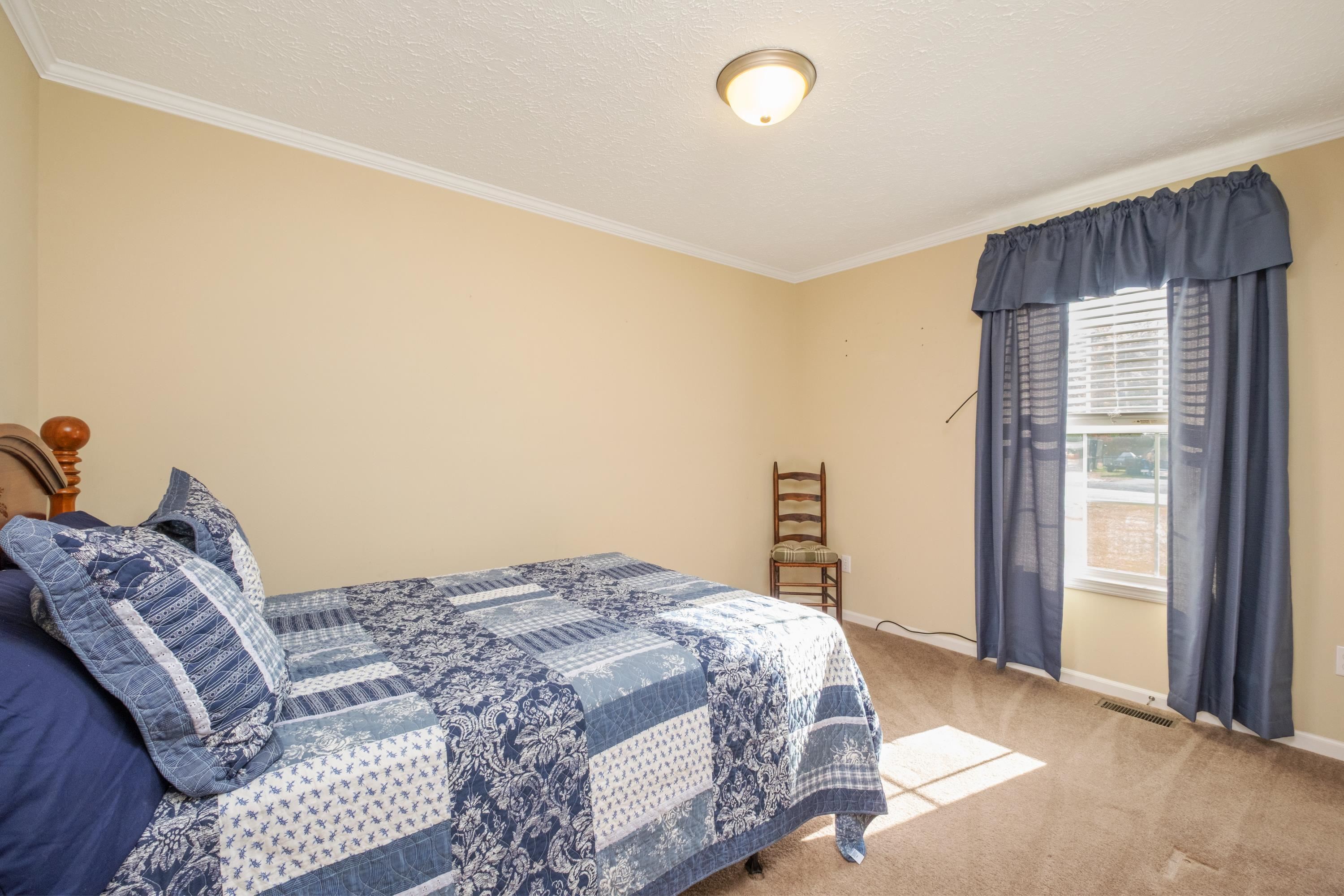 1715 3rd Street Waynesboro, VA 22980 - Photo 23 of 33 a bedroom with a bed and a window