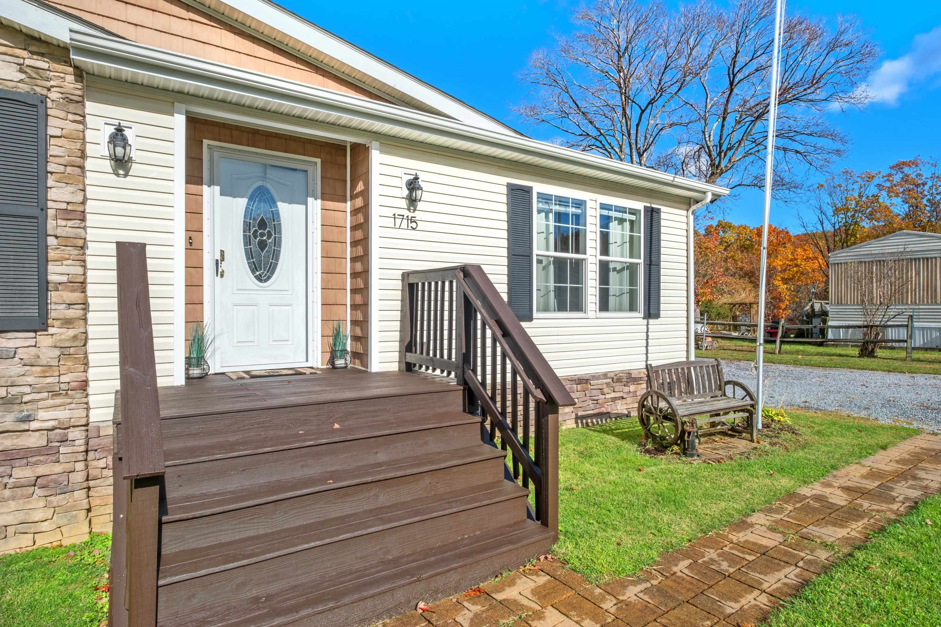 1715 3rd Street Waynesboro, VA 22980 - Photo 31 of 33 a view of a house with backyard and wooden deck