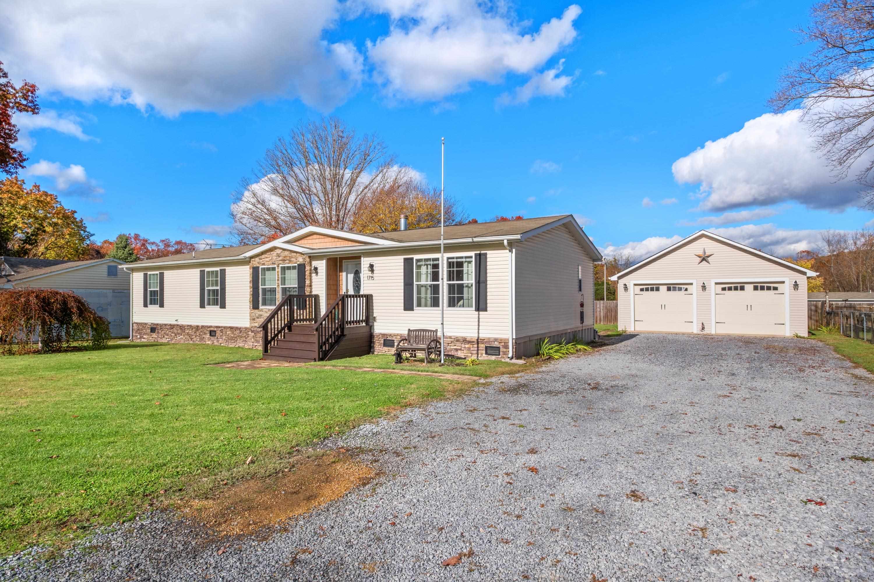 1715 3rd Street Waynesboro, VA 22980 - Photo 32 of 33 a front view of a house with a yard and garage