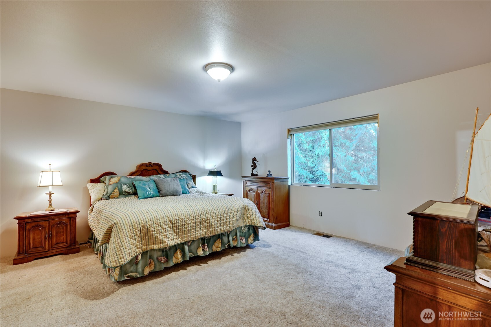 20919 President Point Road Northeast Kingston, WA 98346 - Photo 12 of 24 a spacious bedroom with a bed and a window