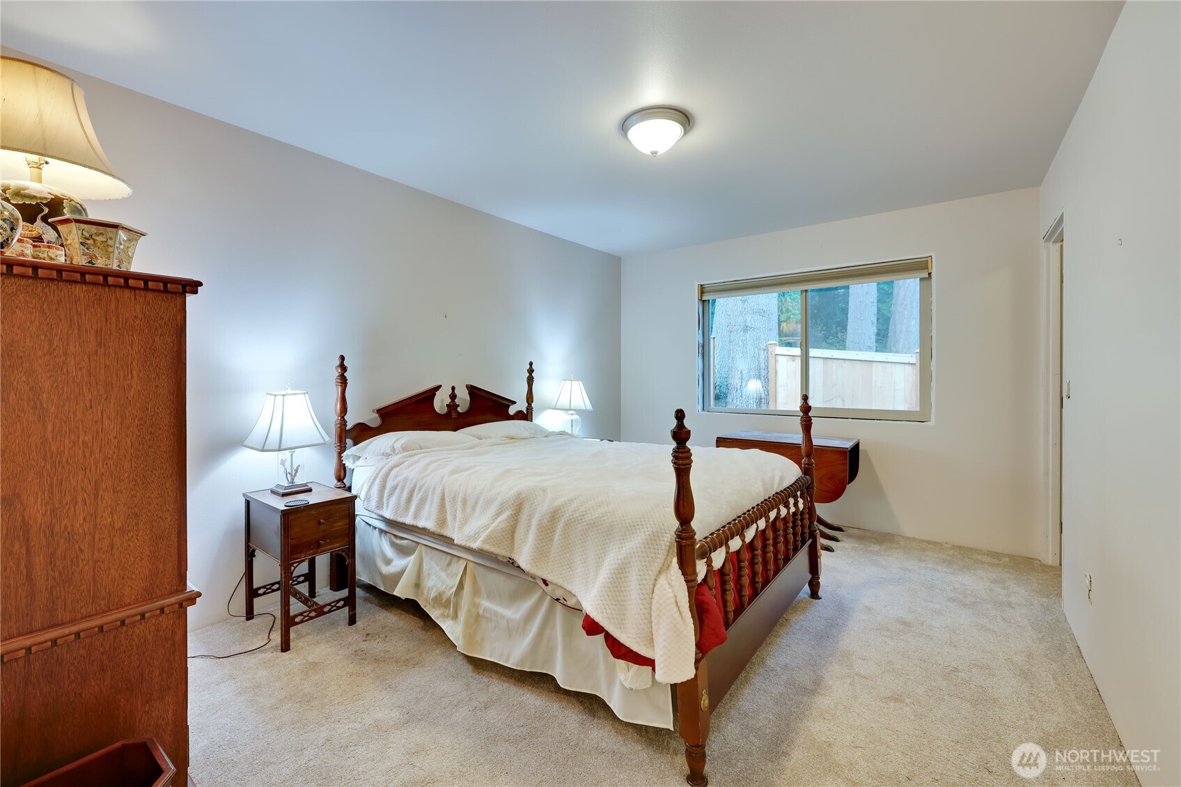 20919 President Point Road Northeast Kingston, WA 98346 - Photo 16 of 24 a bedroom with a bed and window