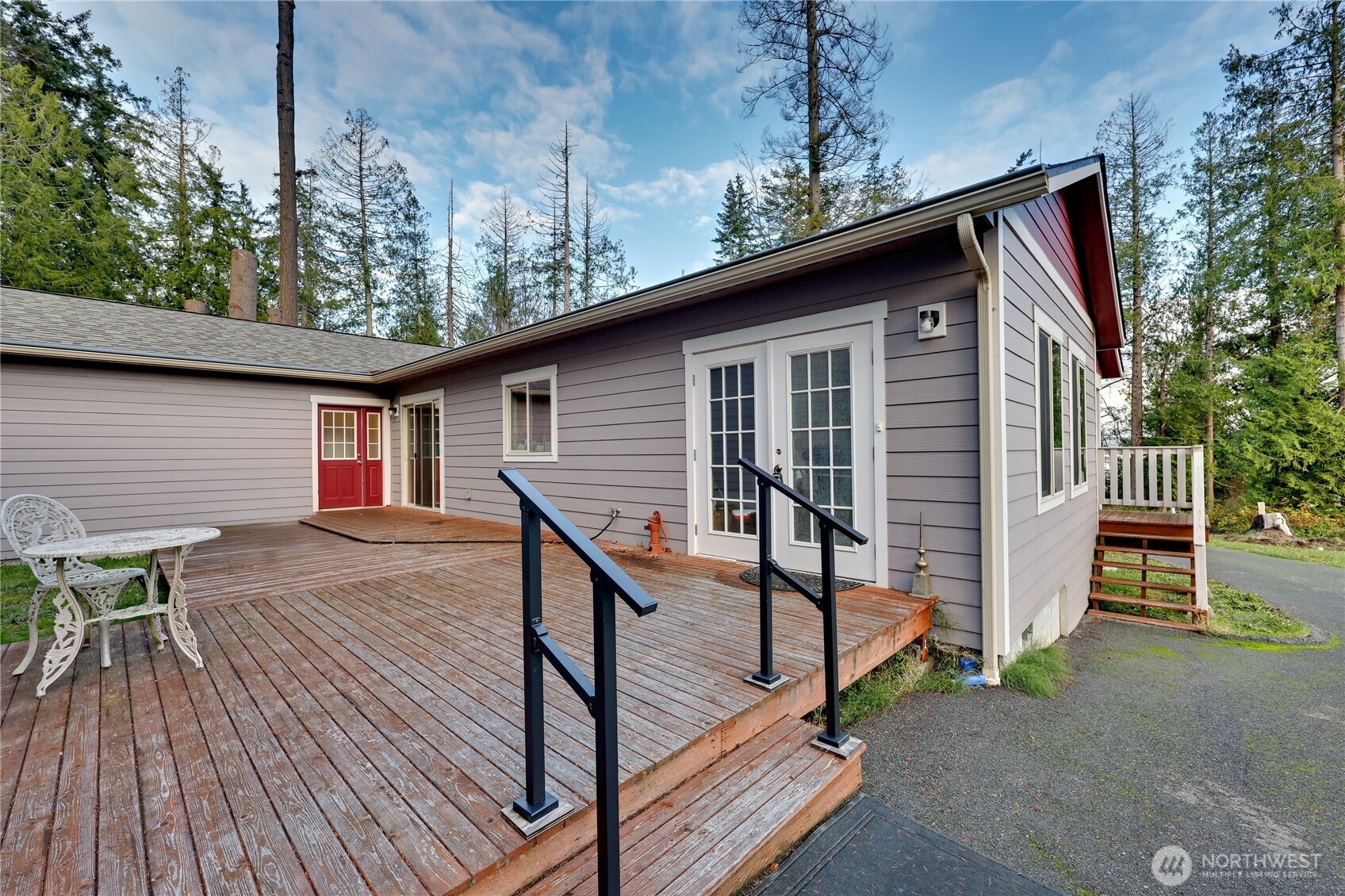 20919 President Point Road Northeast Kingston, WA 98346 - Photo 21 of 24 a view of backyard with deck and wooden floor