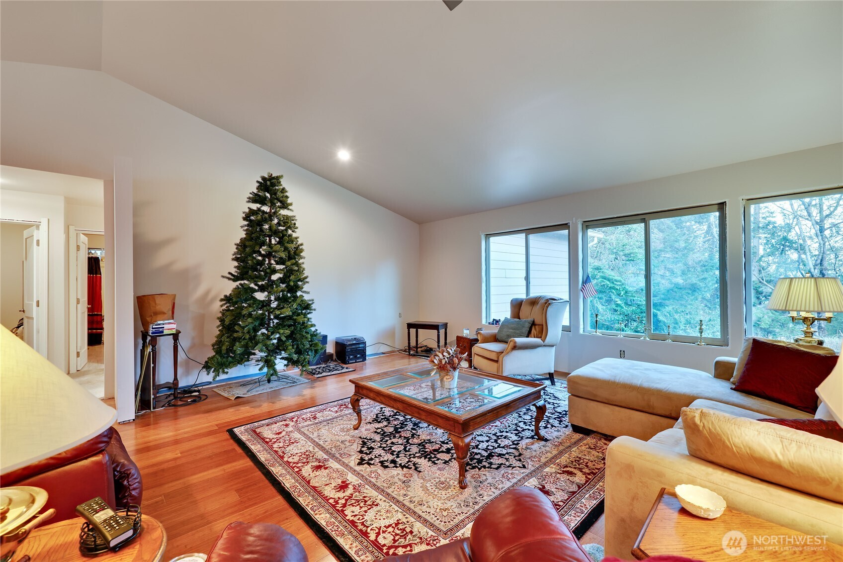 20919 President Point Road Northeast Kingston, WA 98346 - Photo 5 of 24 a living room with furniture and a large window