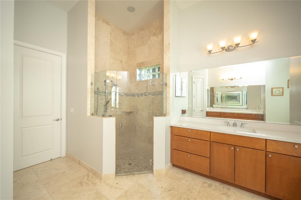 6359 Bellamalfi Street Boca Raton, FL 33496 - Photo 35 of 86 a bathroom with a double vanity sink a mirror and a shower