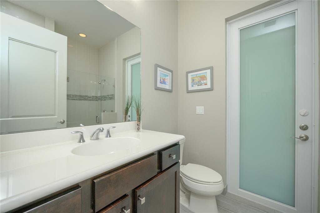 6359 Bellamalfi Street Boca Raton, FL 33496 - Photo 42 of 86 a bathroom with a sink toilet and a mirror
