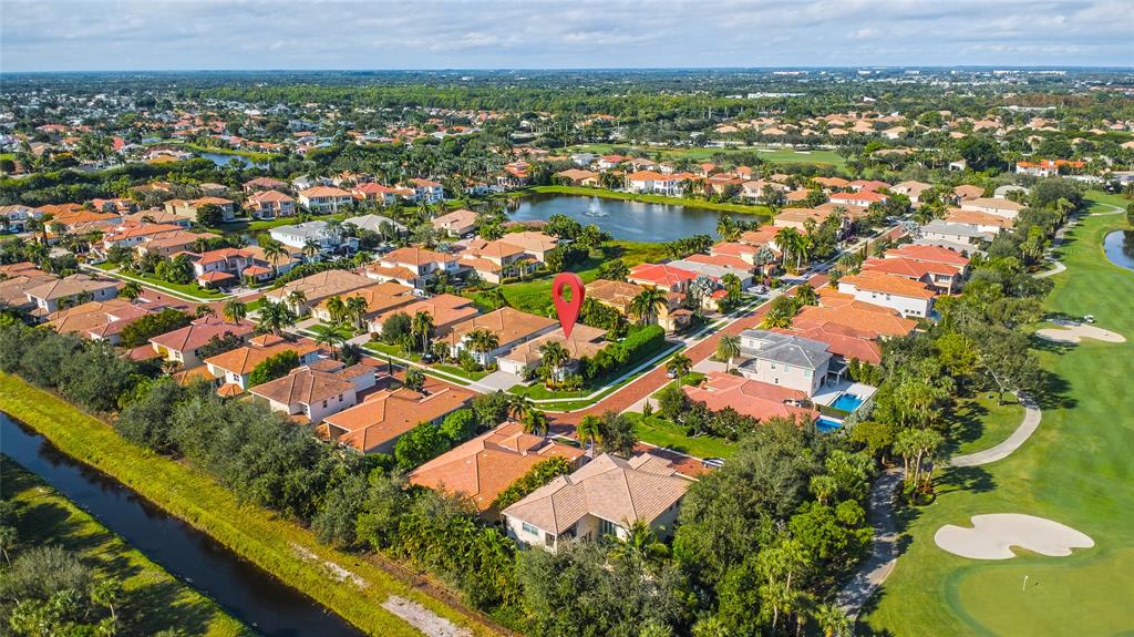 6359 Bellamalfi Street Boca Raton, FL 33496 - Photo 65 of 86 an aerial view of residential houses with outdoor space and lake view